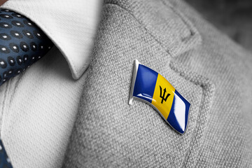 Metal badge with the flag of Barbados on a suit lapel