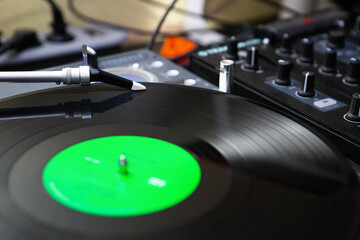 Turntables needle on vinyl record. Turn table playing music with analog records