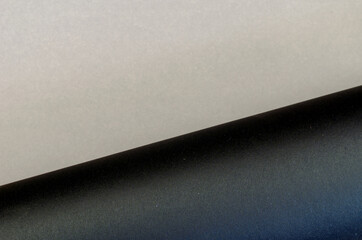 Two-color multitasking background. Gray-black surface. Top view. Selective focus.