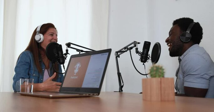 Hosts having podcast session together - Female speaker making an interview during live stream - Technology trends concept