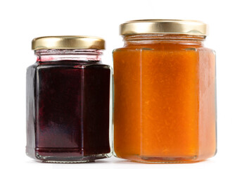 Two jars of fruity jams isolated on white background.