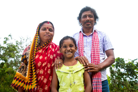 3 indian Rural farmer Parents and daughter standing