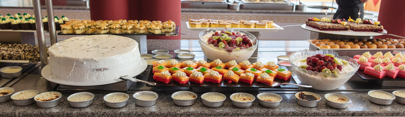 Sweet cake on a shelf in a cafe.