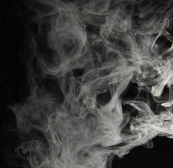 clouds of white smoke on a black background