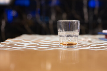 Several glasses of brazilian cachaca isolated on rustic wooden background, variations and types of brazil cachaca, typical drink from brazil.