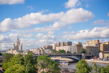 Fototapeta na wymiar View of the city megalopolis and riding river
