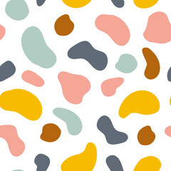 Abstract animal print seamless vector pattern. Hand-drawn colorful, distorted, circles pattern in blue, pink, orange, and brown.
