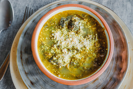 Traditional Armenian herbal soup with aveluk or horse sorrel. The concept of folk cuisine and healthy vegetarian dishes