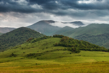 Mood landscape of misty cold mountains. An idyllic background for relaxation and reflection