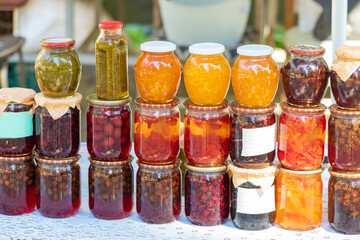 Assortment of various glass jars with jam. The concept of home-made preparations of healthy sweets