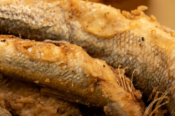 Small fried fish, surface texture, background image, close-up, selective focus.
