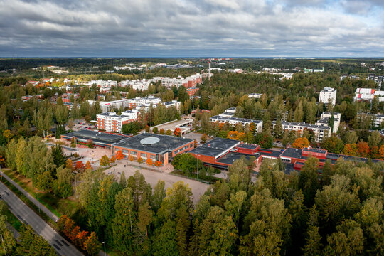Aerial view over the school building during the gold autumn in Finland.