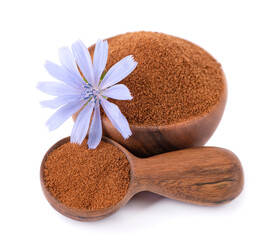 Chicory powder and flower in wooden bowl and spoon, isolated on white background. Cichorium intybus.