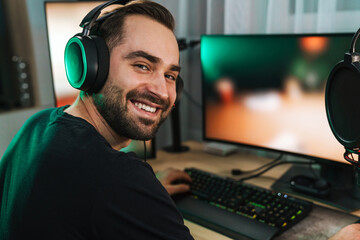 Happy young man gamer streamer in headphones © Drobot Dean