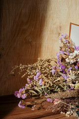 Beautiful bouquet of various dried flowers in the sun close up