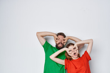 Fototapeta premium married couple hug friendship colorful t-shirts family light background