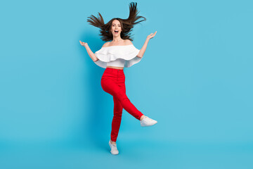 Fototapeta na wymiar Full length photo of funny brunette young lady dance wear blouse jeans isolated on blue color background