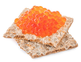 Red caviar over crispy flat bread isolated on white background.  Delisious food - salmon caviar