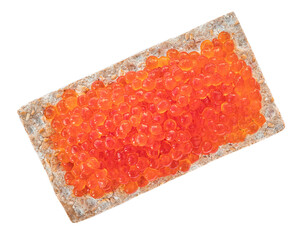 Red caviar over crispy flat bread isolated on white background.  Delisious food - salmon caviar top view. Flat lay