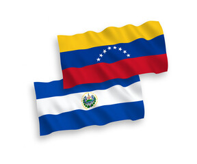 National vector fabric wave flags of Venezuela and Republic of El Salvador isolated on white background. 1 to 2 proportion.