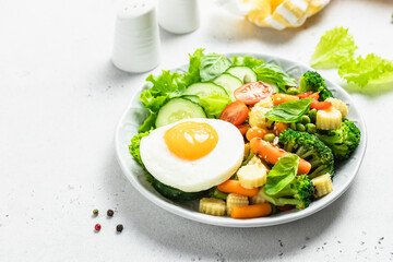Keto diet healthy lunch vegetables egg bowl. Top view, space for text.