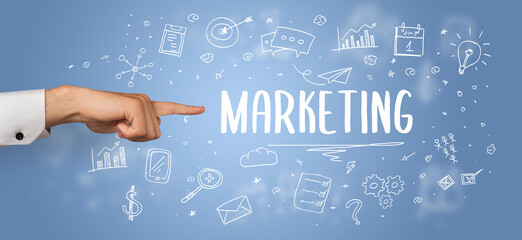 Close-Up of cropped hand pointing at business inscription