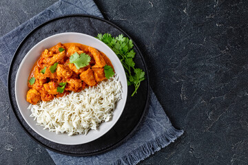 butter chicken, curry of spicy chicken with rice - Powered by Adobe