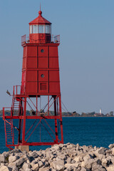 A Red Breakwater Lighthouse Along Lake Michigan