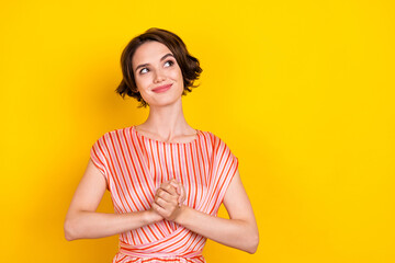 Fototapeta premium Portrait of attractive cheerful girl fantasizing copy space isolated over bright yellow color background