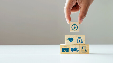 business hand-select on-off icon on wooden cube block and medical icon good health care and insurance concept