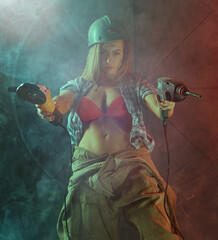 Beautiful girl in construction clothes