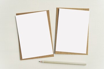 Two empty white notecards on brown kraft paper envelopes,  set of 2 greeting cards, postcards...