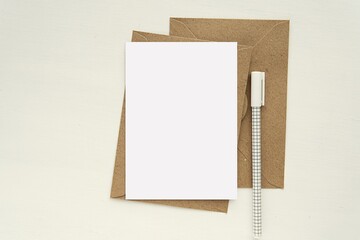 A6 size blank card mockup, brown kraft paper envelopes and pen, notecard, postcard, greeting card mock up.