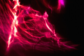 Abstract red and purple light neon on black background. Dark night glow futuristic motion wallpaper with noise texture