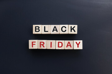 Obraz premium Wooden cube block with words Black friday. Wooden cube block ready for retail with black Friday icon. 