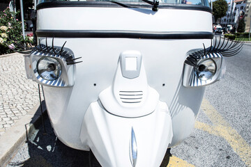 eyelashes in the headlights of a car