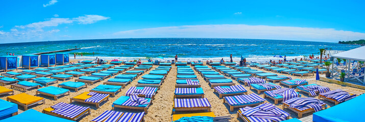 Panorama of Otrada Beach with blue trestle beds, Odessa, Ukraine