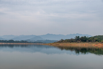 The view of the lake on a cloudy day in autumn