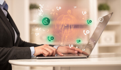 Doctor working on laptop with healthcare concept