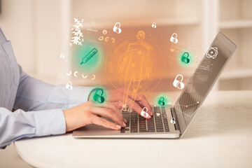 Doctor working on laptop with healthcare concept