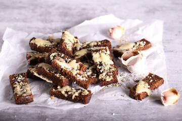 croutons with garlic and herbs are on the table
