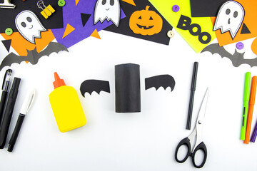 Craft with a child for Halloween from rolls of toilet paper and black paper bat. Step-by-step instruction. step 6.