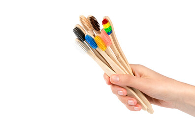 wooden eco friendly bamboo toothbrushes on a white background
