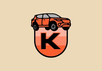 Line art illustration of car with K initial letter