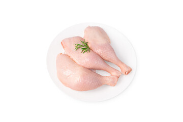 Three raw whole chicken legs on a white plate on a white isolated background. Fresh chicken legs.