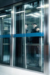 Security guards standing in elevator