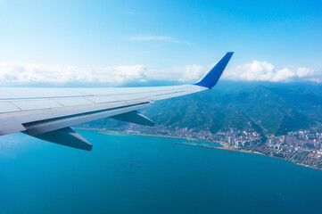 Wing of a passenger plane and the sky overboard