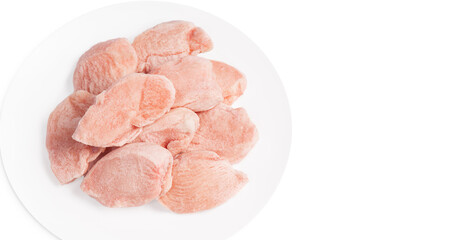 Raw frozen fillet isolated on white background.Frozen pieces of fresh chicken meat on a white...