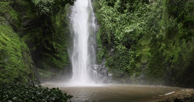 Tagbo Water falls Rural bush tropical rainfrest Ghana. Waterfall Mount Afadjato, Ghana highest mountain. Eastern Region border of Togo. Hike through cocoa plantation, forest and tropical rainforest.
