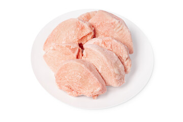 Frozen chicken fillet. Raw frozen fillet isolated on white background.Frozen pieces of fresh chicken meat on a white plate.Isolade.Close up, space for text, copyspace